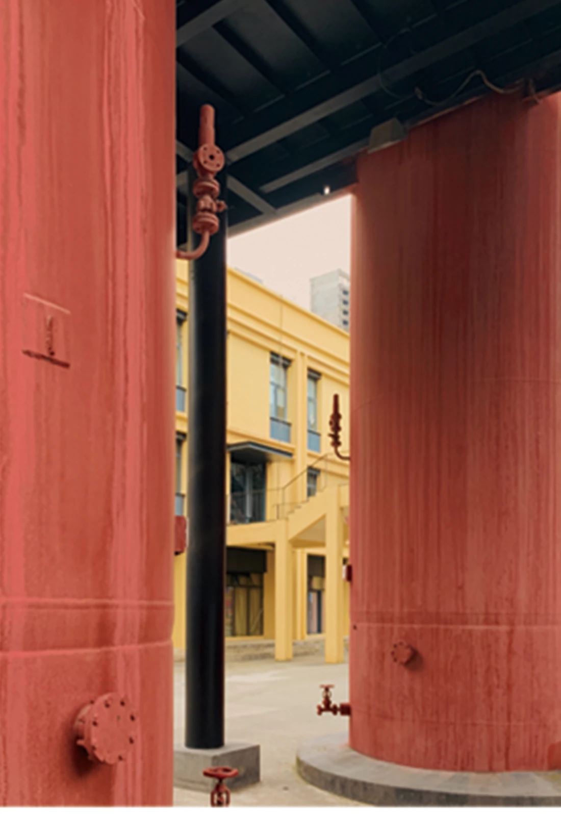 Red architectural column framing a courtyard